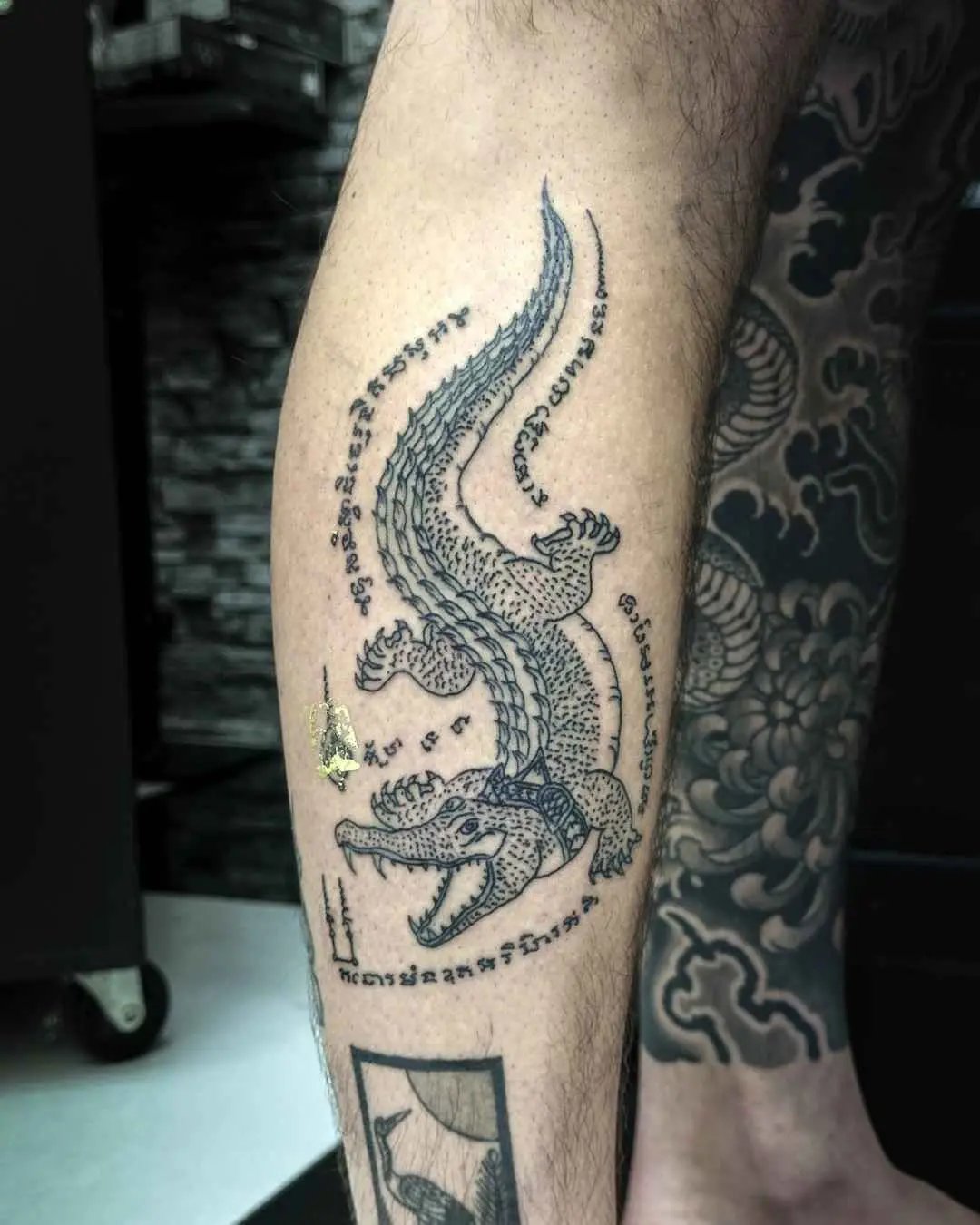 crocodile sak yant tattoo by fame tattoo
