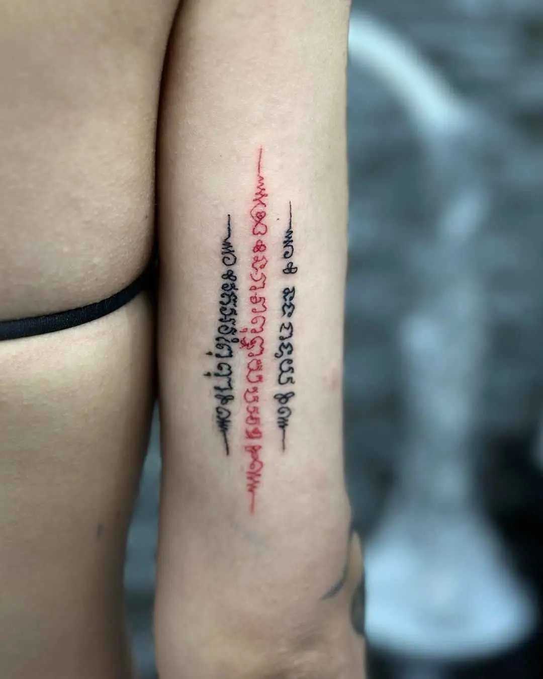 three line sak yant tattoo by fame tattoo