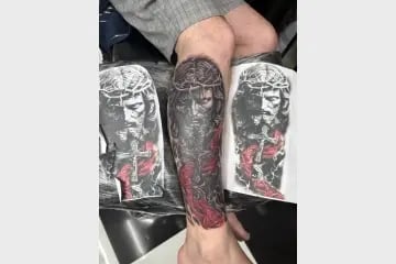 religious sleeve tattoo