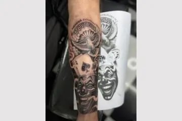 religious sleeve tattoo