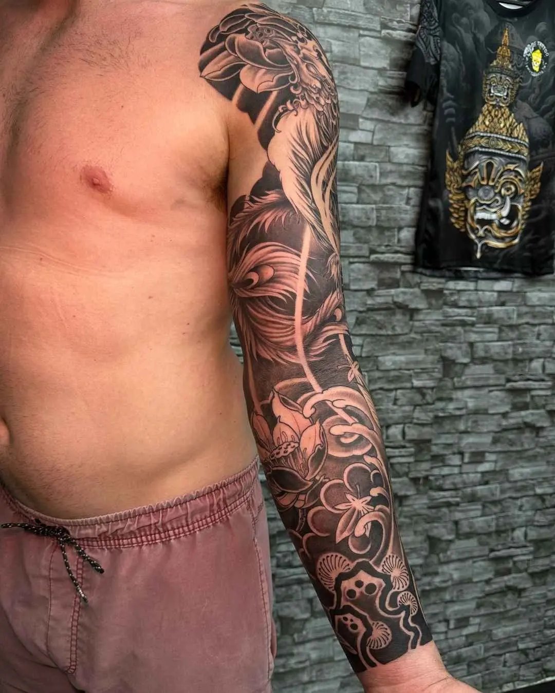 Japanese full arm tattoo by fame tattoo