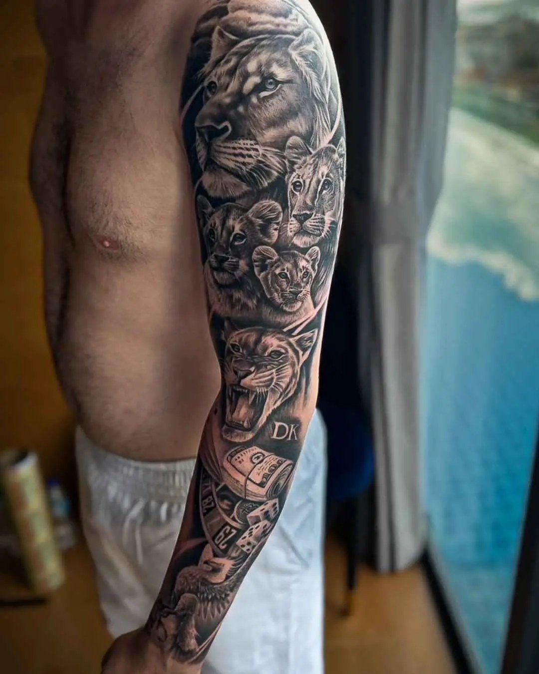 realism tattoo, full arm by fame tattoo