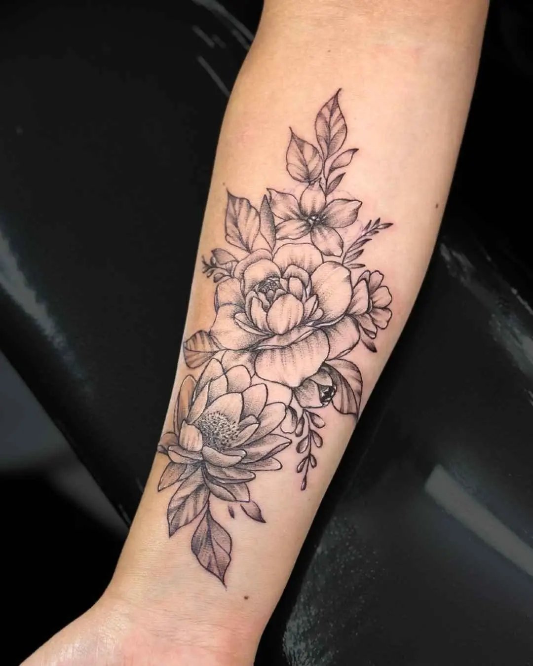 floral fine line tattoo by fame tattoo