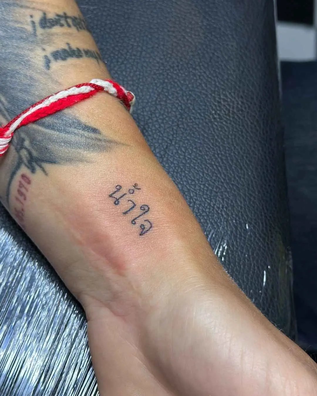thai word fine line tattoo by fame tattoo