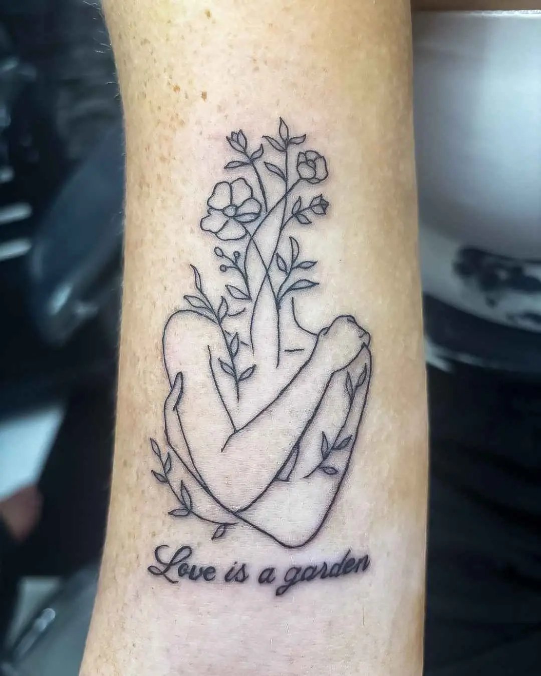 floral fine line tattoo by fame tattoo