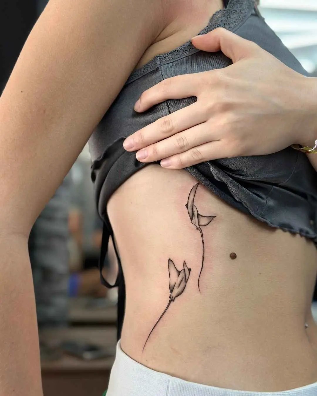 ray fine line tattoo by fame tattoo