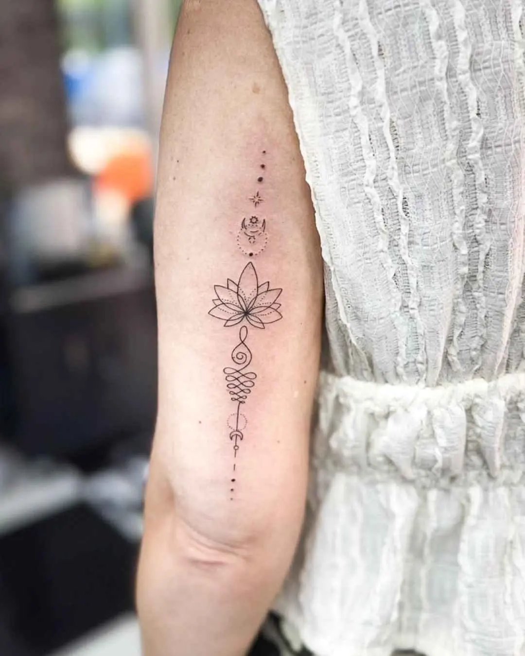 fine line tattoo by fame tattoo