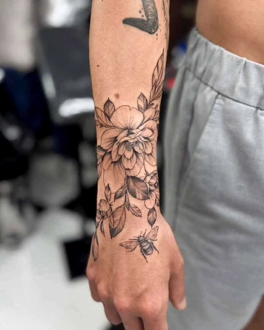 floral fine line tattoo by fame tattoo